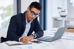 Business owner reviewing registered agent documents and legal notices for LLC compliance and government filings