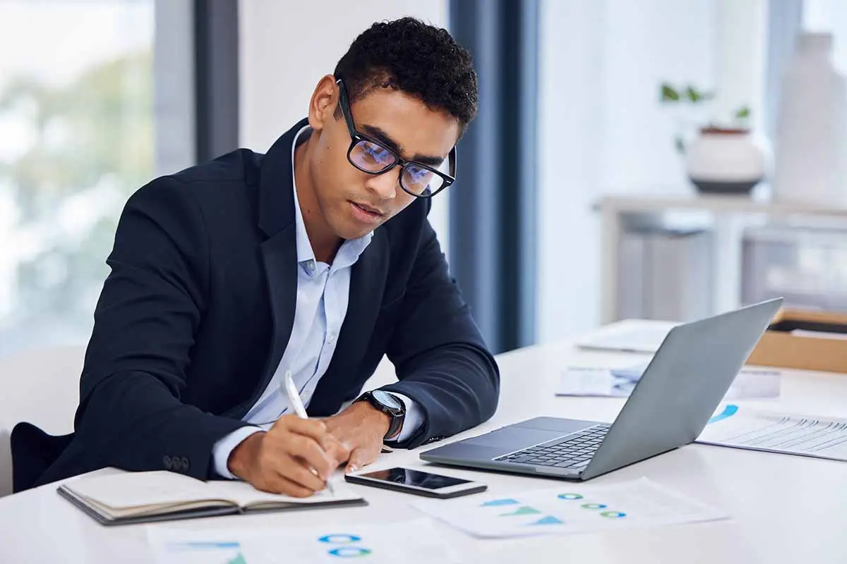 Business owner reviewing registered agent documents and legal notices for LLC compliance and government filings