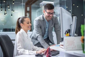 Business owners comparing LLC vs S-Corp tax advantages and structure differences while reviewing financial documents and business formation options