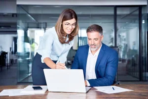 Business partners discussing LLC agreement vs operating agreement and whether do I need an operating agreement for my LLC to maintain compliance and liability protection