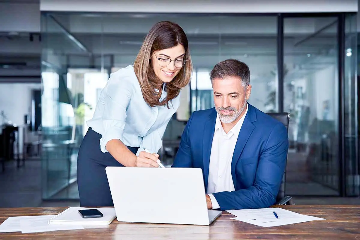 Business partners discussing LLC agreement vs operating agreement and whether do I need an operating agreement for my LLC to maintain compliance and liability protection