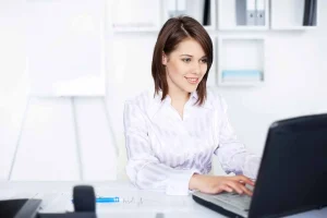 Business owner reviewing LLC renewal and reinstatement compliance information online