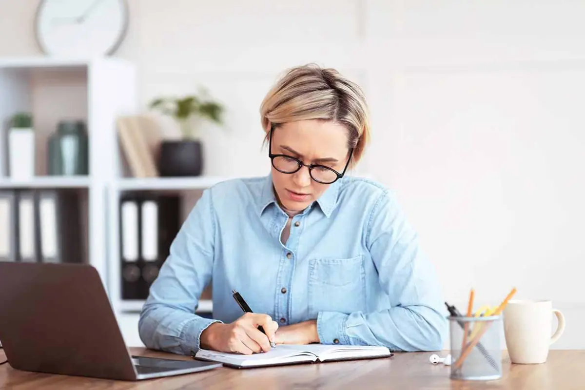Small business owner deciding if forming an LLC is worth it for liability protection and business growth