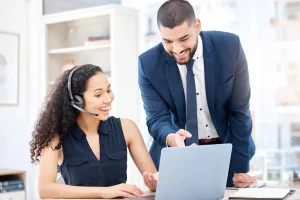 Business professionals discussing single-member LLC vs multi-member LLC options on a laptop